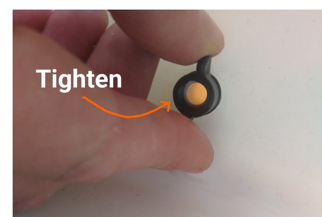 Hand-tightening the wingnut inside the container