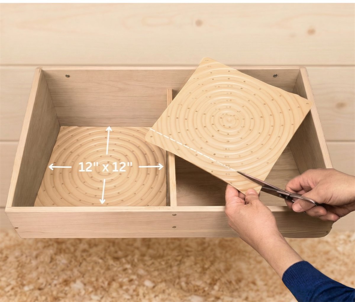 A pad measured at 12 by 12 inches in a nest box, and a second pad being cut down with scissors