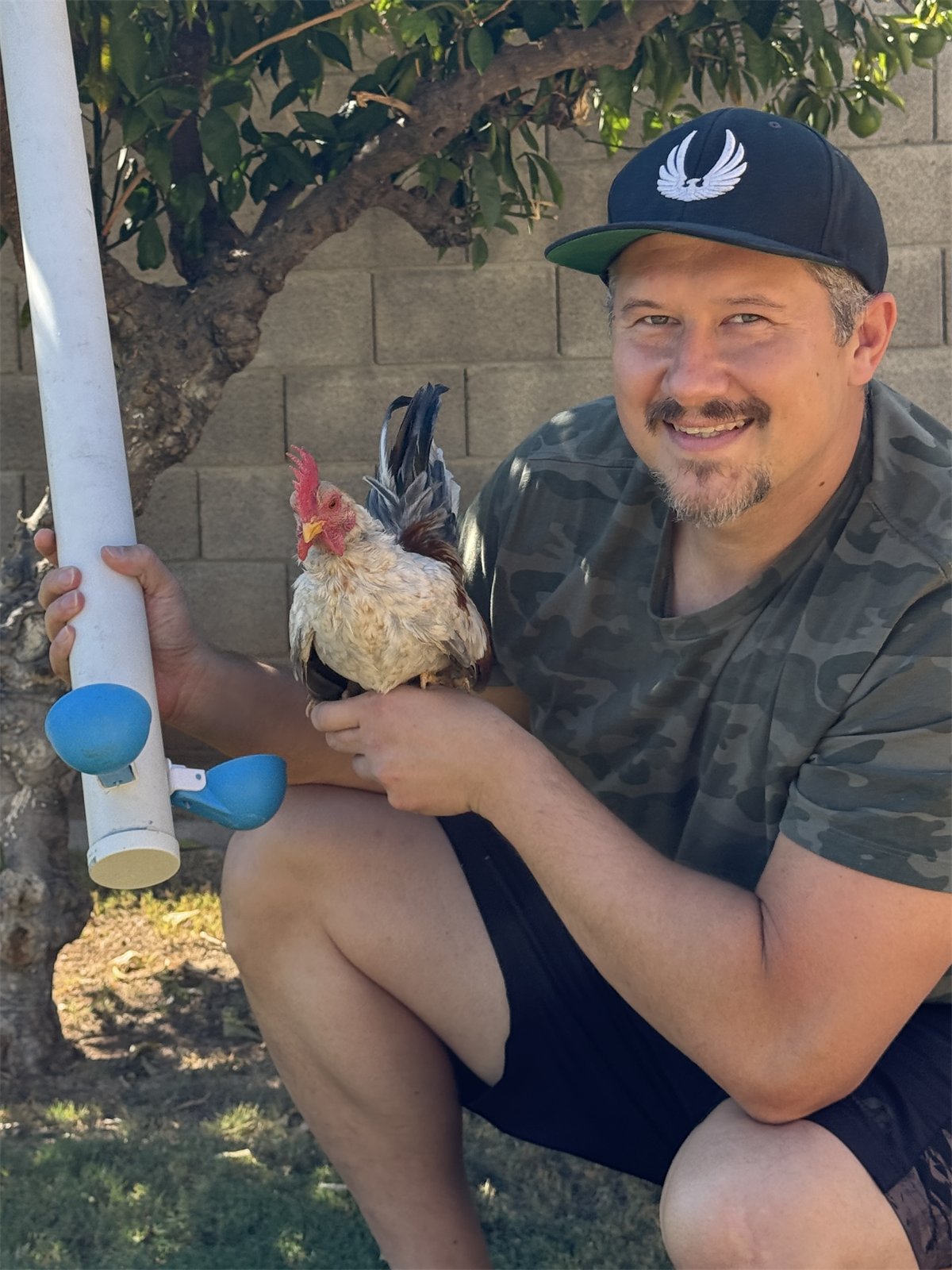 Keeper with a bantam and a PVC cup line
